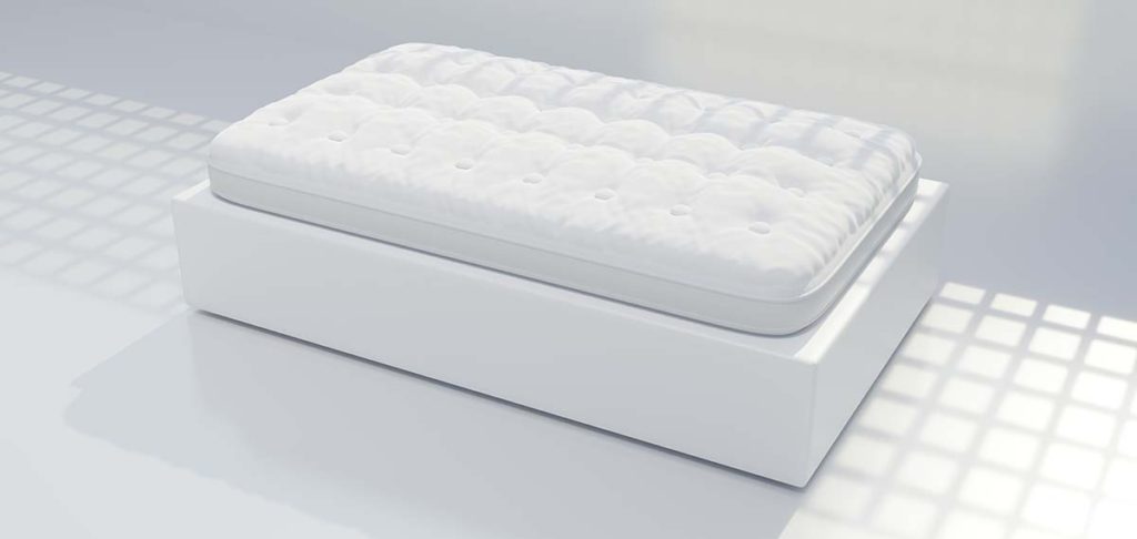 Łóżko oraz materac w białym kolorze